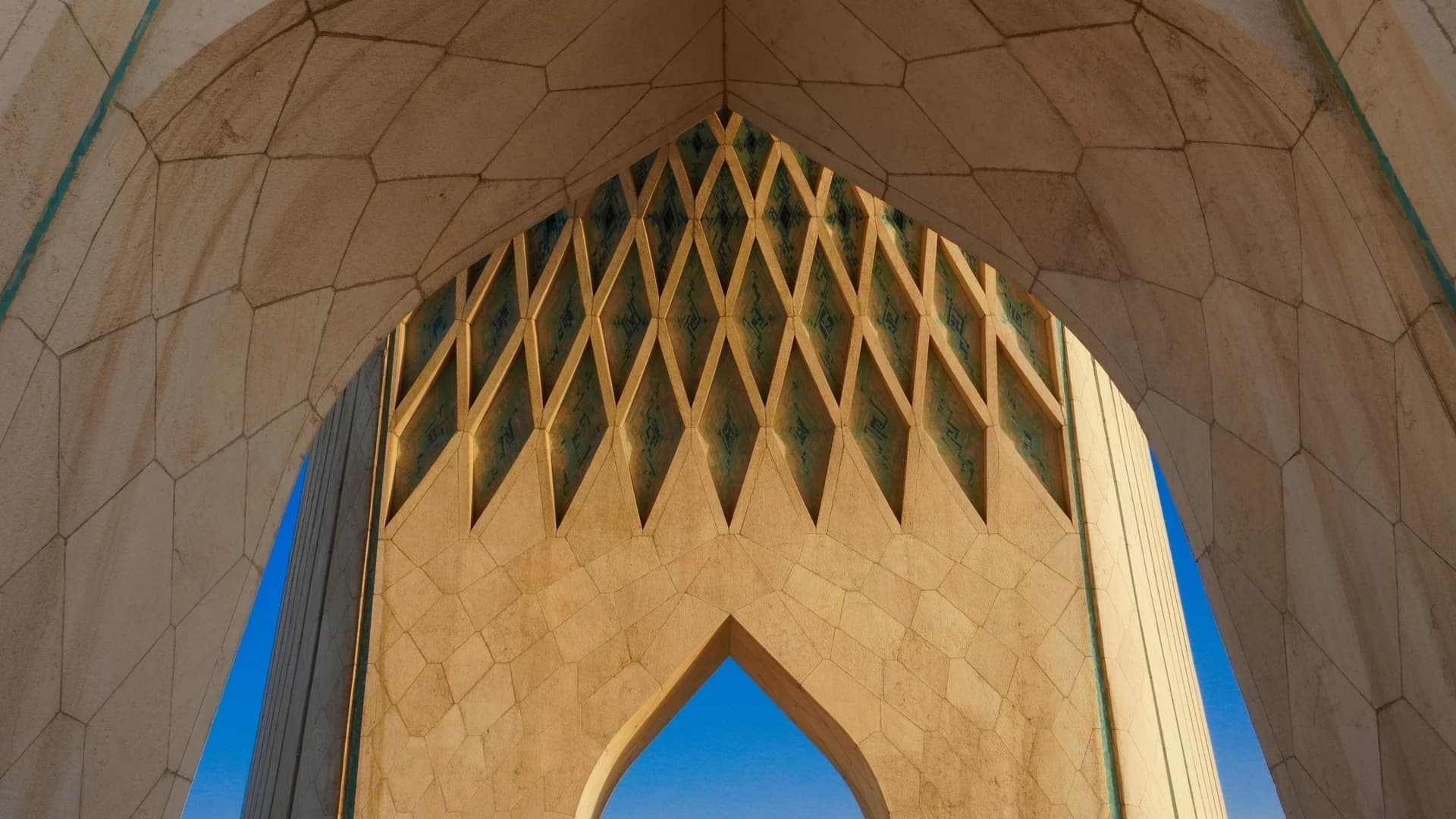Close-up architectural details of the iconic Azadi Tower in Tehran, Iran.