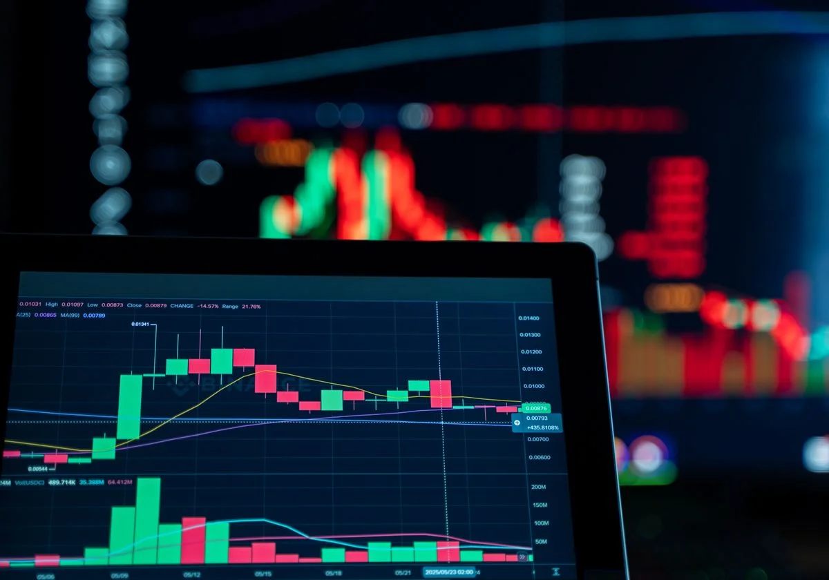 A cryptocurrency trading chart on a laptop screen