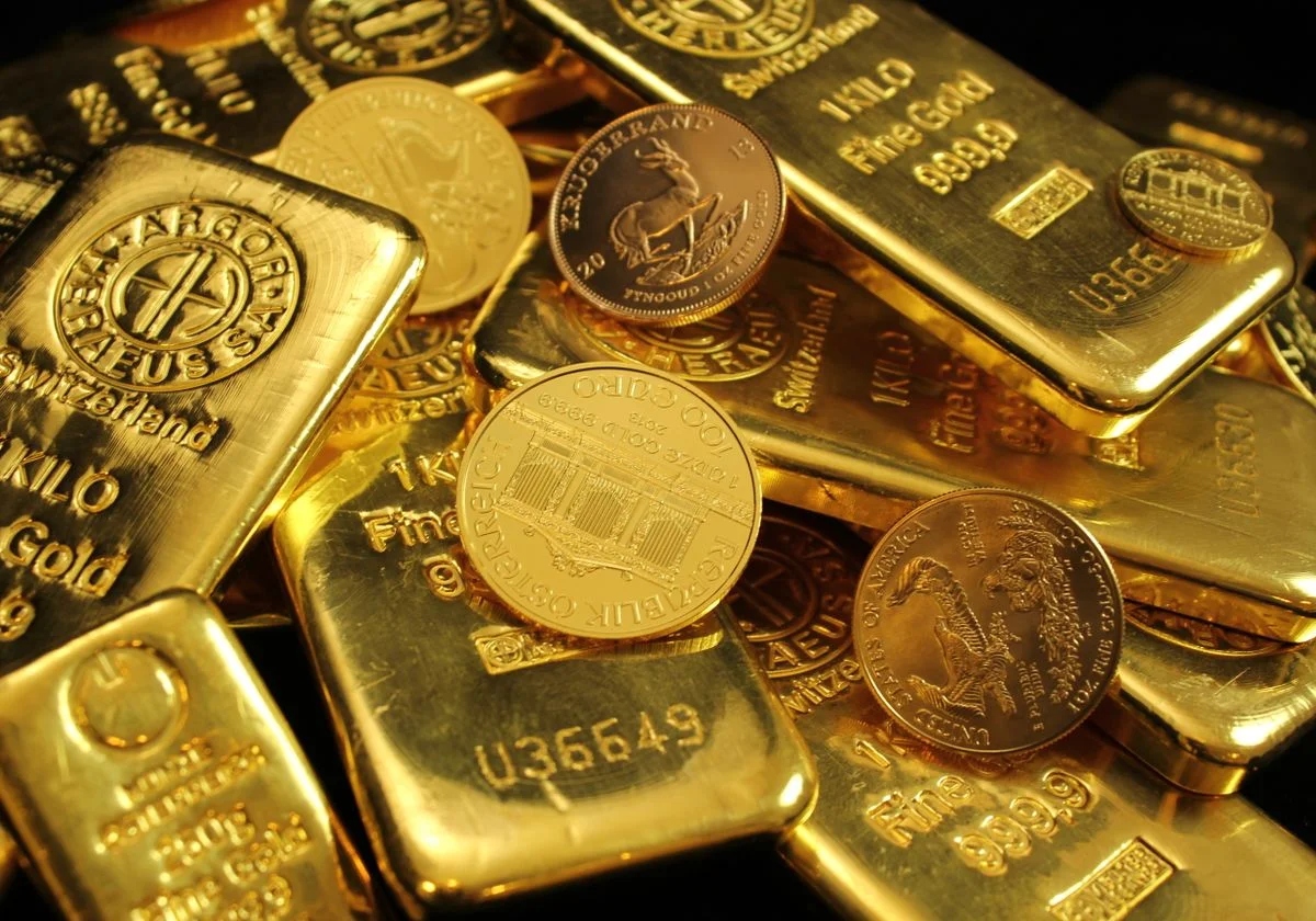 A pile of gold bars and coins